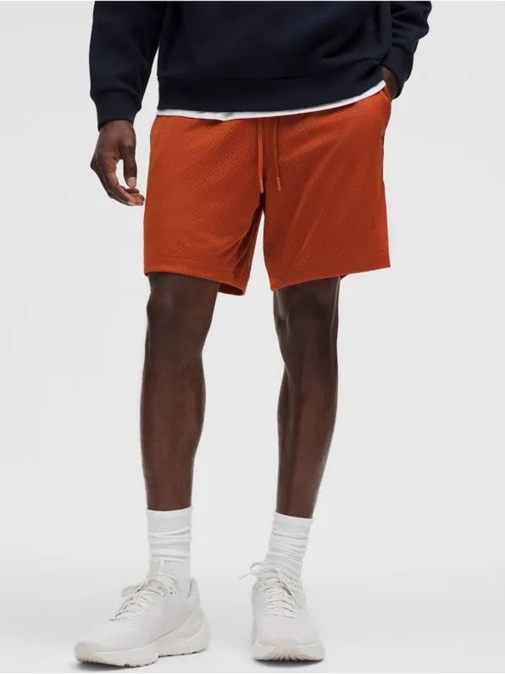Lululemon Double-Layered Mesh Linerless Short 7" in color ARTN (bright orange)